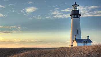 Solitary sentinel, Secluded coastline, Moody atmosphere, Silent guardian HD wallpaper