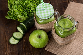 Refreshing green smoothie made with apple, cucumber, and lettuce served in mason jars on wooden background. HD wallpaper