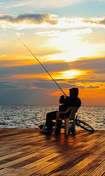 Fishing sunset, Vivid colors, Breathtaking scenery, Nature's beauty HD phone wallpaper
