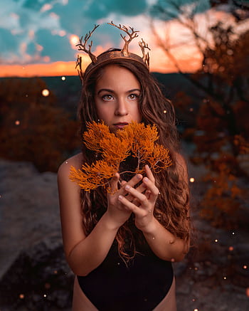 Captivating fantasy-themed portrait with an autumnal backdrop and mystical elements. HD phone wallpaper