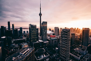 A breathtaking aerial view of the Toronto skyline featuring the CN Tower during sunset. HD wallpaper