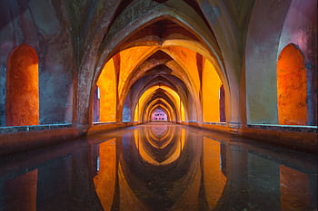 Beautiful Gothic arches reflecting in water, vibrant colors create a mesmerizing effect. HD wallpaper