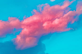 A vibrant pink cloud against a bright blue sky, showcasing a dreamy and creative cloudscape. HD wallpaper
