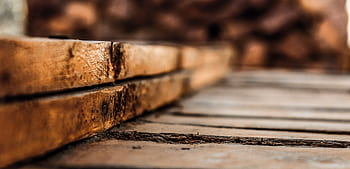 Detailed close-up of rustic wooden planks showcasing texture and earthy tones. HD wallpaper