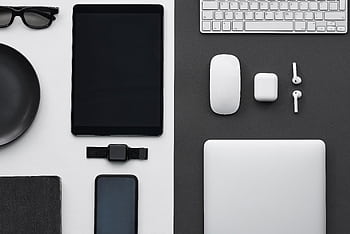 Stylish flatlay of modern tech gadgets including tablet, smart, smartwatch, and accessories. HD wallpaper