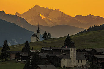 Village with Church, mountains, church, sun, village HD wallpaper