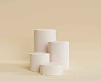 Elegant beige cylindrical podiums for a sleek and minimal design presentation. HD wallpaper