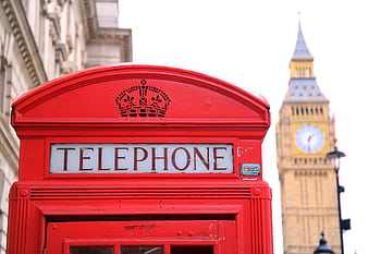 Classic red tele booth with Big Ben in the background, symbolizing London. HD wallpaper