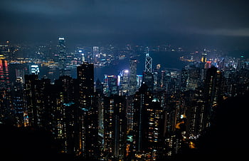Stunning nighttime view of Hong Kong's vibrant skyline with illuminated skyscrapers. HD wallpaper