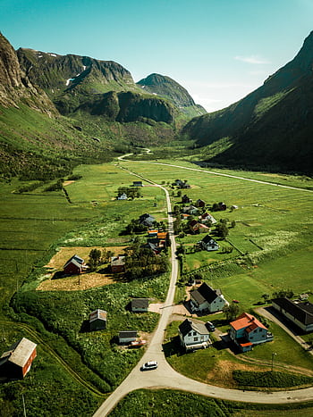 Explore the serene beauty of Lenvik, Norway's lush valleys and charming village from above. HD phone wallpaper