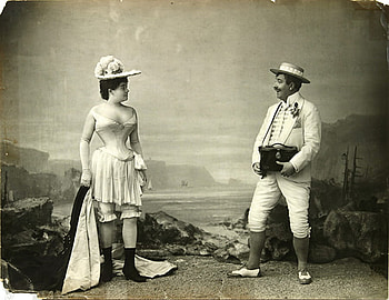 Modesty-it's still in, corset, woman, man, beach HD wallpaper