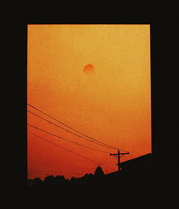 Silhouetted view of smoky orange sunset through window in Portland with power lines. HD phone wallpaper