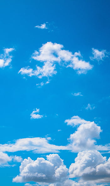 A serene of a bright blue sky with fluffy white clouds, perfect for peaceful backgrounds. HD phone wallpaper