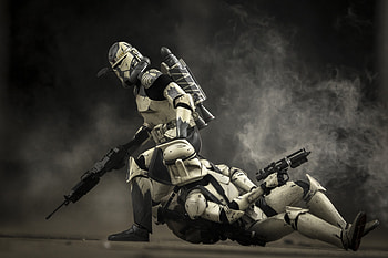 Clone Commander drags a wounded clone out of a kill zone after being HD wallpaper