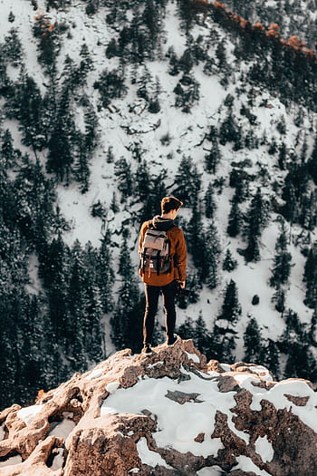 Exploring the snowy peaks of Montezuma, Colorado during a winter hike. HD phone wallpaper