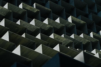 Dynamic geometric pattern of an architectural facade in Toronto, showcasing modern design. HD wallpaper