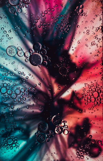 Vibrant abstract art of floating bubbles in multicolored liquid background. HD phone wallpaper