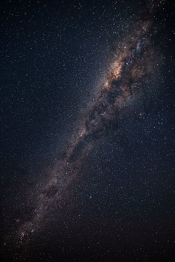 Breathtaking view of the Milky Way galaxy captured at night in Punta Ballena, Uruguay. HD phone wallpaper