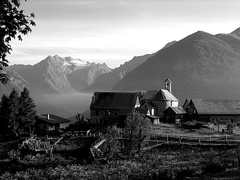 beautiful farm in front of a mountain range, fields, farm, mountains, black and white HD wallpaper