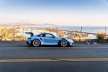 Porsche Racing Beauty on Scenic Coastal Road, Car HD wallpaper