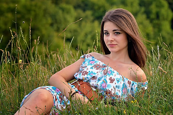 Dana Kareglazaya, black braelet, brunette, trees, tan leather belt, lying in tall grass, floral dress off shoulders HD wallpaper