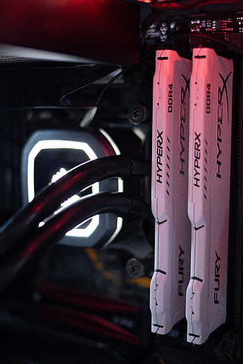 Detailed view of HyperX Fury DDR4 RAM in a gaming PC build with LED lighting. HD phone wallpaper