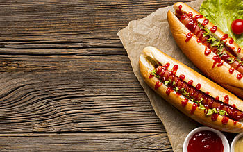 Hot dog with sauces, Tantalizing toppings, Savory sausage, Wooden backdrop HD wallpaper