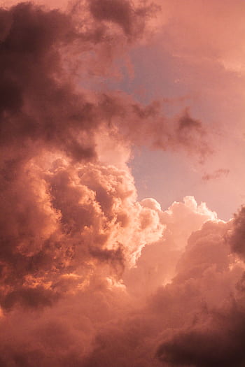 Vibrant pink clouds creating a dramatic scene at twilight, showcasing nature's beauty and majesty. HD phone wallpaper