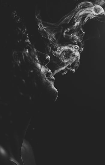 Moody black and white portrait of a woman exhaling smoke in a side view perspective. HD phone wallpaper