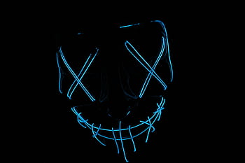 Futuristic neon blue LED mask glowing in the dark, ideal for tech and cyber themes. HD wallpaper
