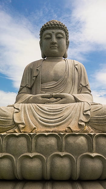 A peaceful Buddha statue beneath a clear blue sky, symbolizing tranquility and spirituality. HD phone wallpaper