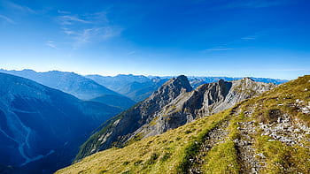 Stunning landscape of the rocky mountains with a vibrant blue sky in Mittenwald, Germany. HD wallpaper