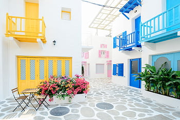 Vibrant Mediterranean architecture with colorful doors and balconies in Greece. HD wallpaper