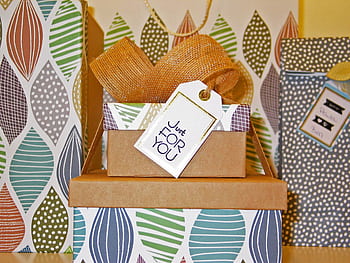 Beautifully wrapped gift boxes with a bow and 'Just For You' tag, perfect for celebrations. HD wallpaper