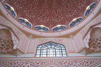 Beautiful intricate mosque interior with pink domed ceiling and stained glass windows in Malaysia. HD wallpaper