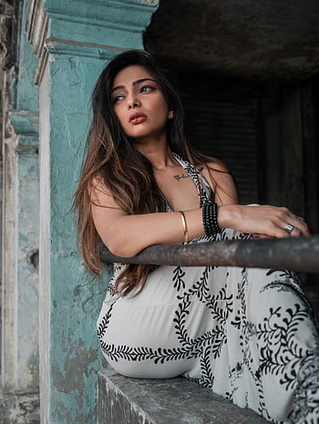 Elegant portrait of a fashionable Indian woman in a New Delhi urban setting, showcasing modern style. HD phone wallpaper