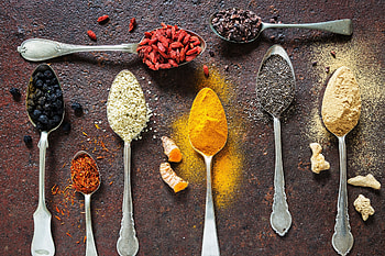 Colorful spices, Spice-filled spoon, Vibrant food, Flavorful HD wallpaper