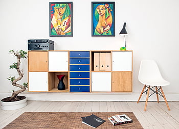 Contemporary room design featuring colorful artwork, sleek furniture, and decorative elements. HD wallpaper