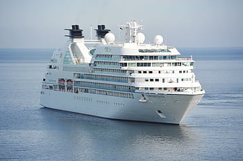 Elegant cruise ship sailing smoothly across tranquil waters under a clear sky. HD wallpaper
