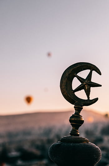 Crescent moon and star against Cappadocia's sunrise with hot air balloons. HD phone wallpaper