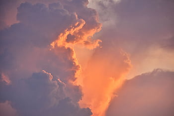 A beautiful display of dramatic sunset clouds with warm colors seen in the sky over Odisha, India. HD wallpaper