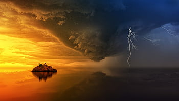 A stunning display of a stormy sunset with lightning striking over a solitary island. HD wallpaper