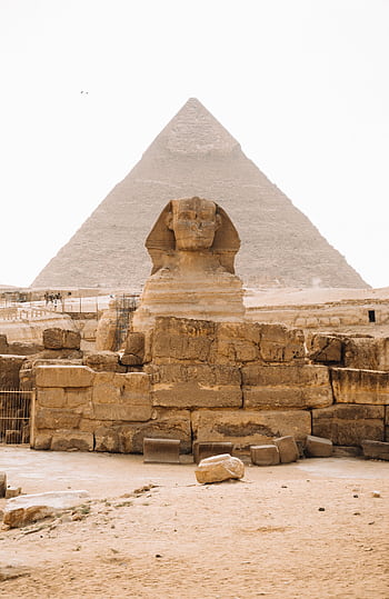 Iconic view of the Sphinx with the Pyramid of Khafre in Giza, Egypt. HD phone wallpaper
