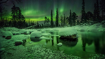 Beautiful Aurora Borealis Northern Lights Snow Covered Stones Trees Reflection On Water During Nighttime Nature HD wallpaper