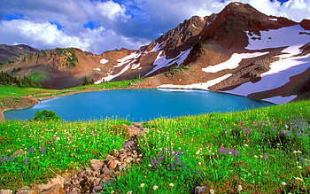 Mountain landscape, blue, nice, wildflowers, hills, snowy, landscape, meadow, beautiful, grass, lake, mountain, cliffs, view, clouds, nature, sky, flowers, lovely, peak HD wallpaper