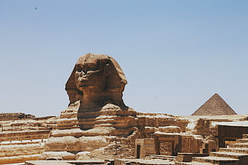 View of the Great Sphinx of Giza and Pyramid, iconic Egyptian landmarks in daylight. HD wallpaper