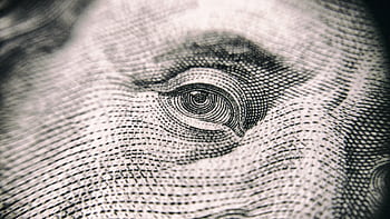 Detailed close-up of a banknote's eye, showcasing its intricate texture and design. HD wallpaper
