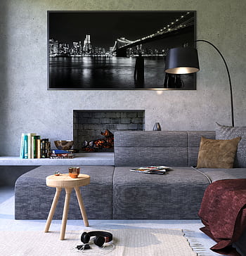 Modern gray living room featuring a fireplace and cityscape artwork, creating a cozy ambiance. HD phone wallpaper