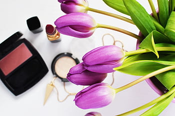 Purple tulips and makeup create a stylish beauty flat lay. HD wallpaper