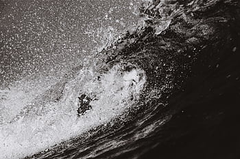 Powerful black and white capturing the energy of ocean waves in motion. HD wallpaper
